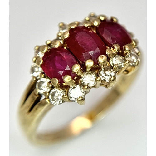 162 - A 9K Yellow Gold Ruby and Diamond Ring. Three oval cut rubies with a diamond surround. Size L. Rubie... 