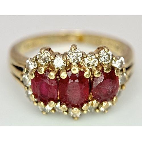 162 - A 9K Yellow Gold Ruby and Diamond Ring. Three oval cut rubies with a diamond surround. Size L. Rubie... 