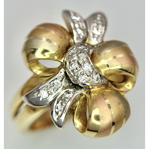 176 - A 14K Yellow and White Gold Ring. Floral form. Size N 1/2. 7.2g.