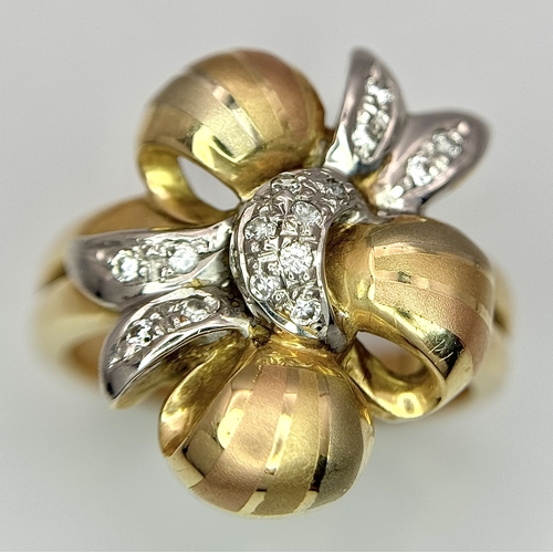 176 - A 14K Yellow and White Gold Ring. Floral form. Size N 1/2. 7.2g.