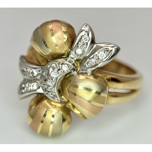 176 - A 14K Yellow and White Gold Ring. Floral form. Size N 1/2. 7.2g.