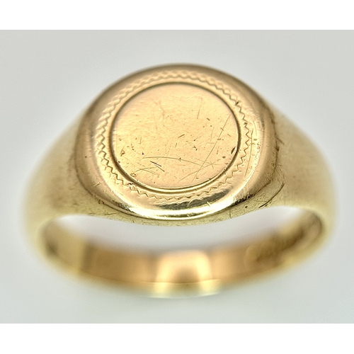 183 - A 9K Yellow Gold Signet Ring. Full UK hallmarks. Size S. 4.9g