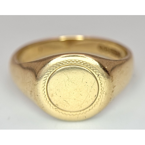 183 - A 9K Yellow Gold Signet Ring. Full UK hallmarks. Size S. 4.9g