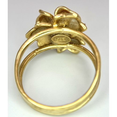 218 - A 14K Yellow Gold and Pearl Ring. Floral form. Size P 1/2. 5.85g