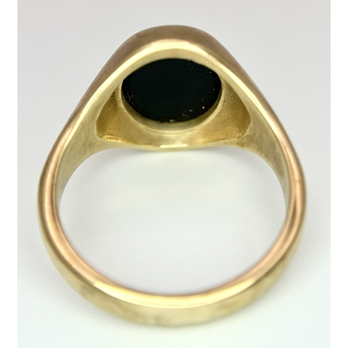 239 - A Vintage 9K Yellow Gold Onyx Signet Ring. Size S 1/2. 7.7g.