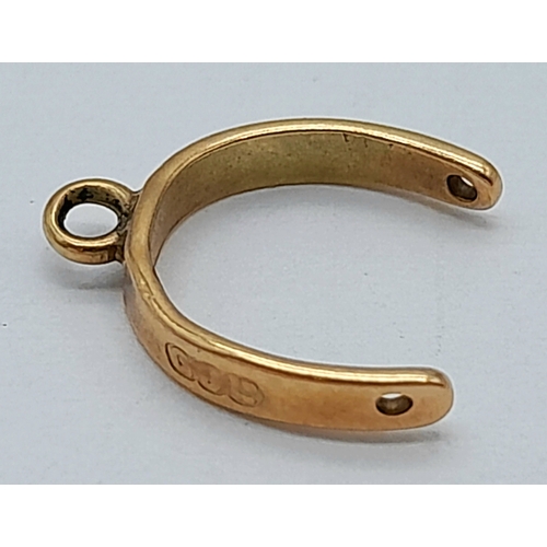 1177 - A 9k Yellow Gold Horseshoe Pendant/Charm. 12mm. 0.4g