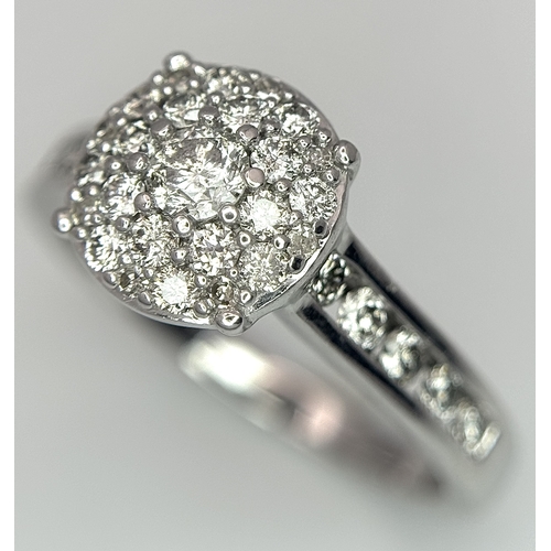 149 - AN 18K WHITE GOLD DIAMOND SET CLUSTER RING. 0.50CTW. 3.9G. SIZE N. SC5085.