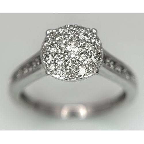 149 - AN 18K WHITE GOLD DIAMOND SET CLUSTER RING. 0.50CTW. 3.9G. SIZE N. SC5085.