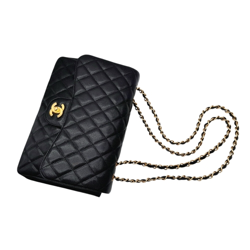 4 - A Chanel Black Caviar Leather Jumbo Classic Flap Bag. Black  caviar leather exterior with gold-toned... 