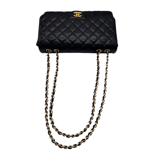 4 - A Chanel Black Caviar Leather Jumbo Classic Flap Bag. Black  caviar leather exterior with gold-toned... 