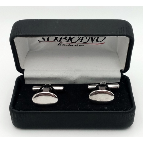 26 - A Pair of 18K White Gold Oval Cufflinks. 9.27g