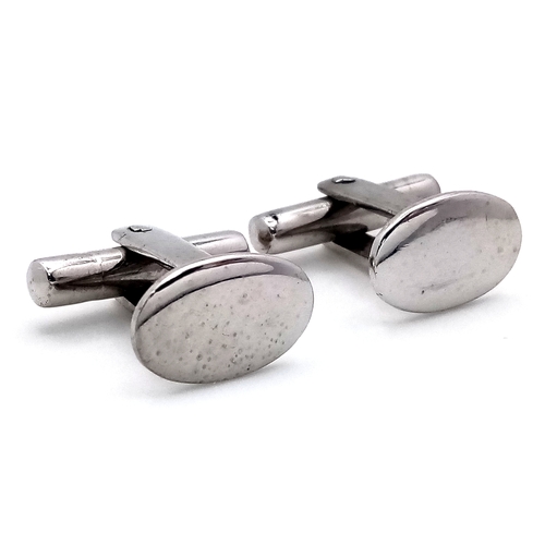 26 - A Pair of 18K White Gold Oval Cufflinks. 9.27g