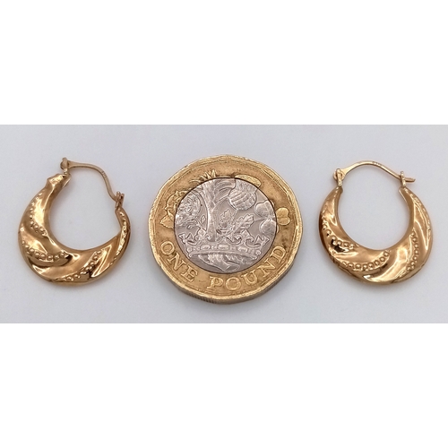 98 - A Pair of 9K Yellow Gold Creole Earrings. 2cm. Slightly misshapen so As found. 0.7g