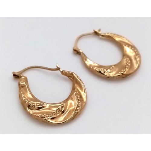 98 - A Pair of 9K Yellow Gold Creole Earrings. 2cm. Slightly misshapen so As found. 0.7g