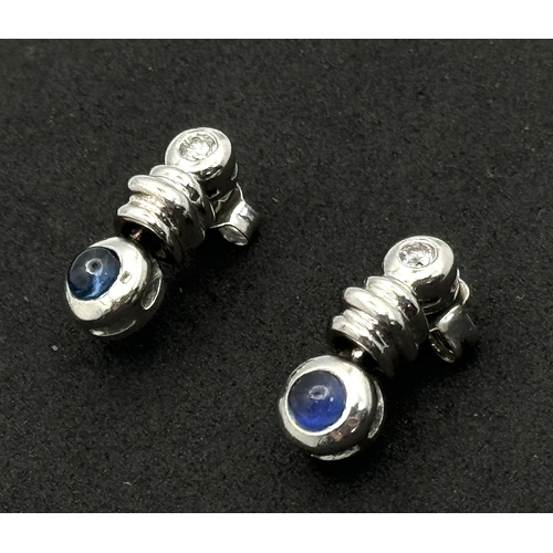 103 - A PAIR OF 18K WHITE GOLD DIAMOND & CABACHON SAPPHIRE DROP EARRINGS - 4.4G TOTAL WEIGHT. TAN4006