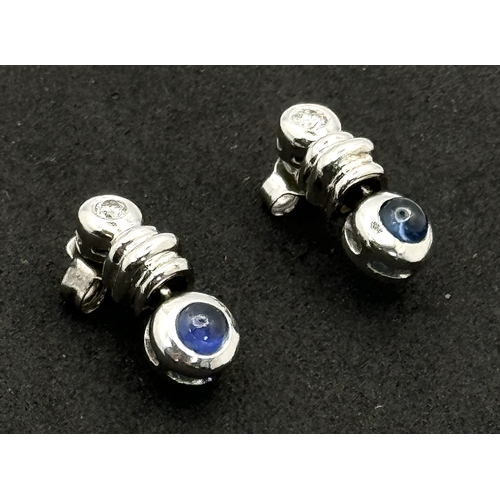 103 - A PAIR OF 18K WHITE GOLD DIAMOND & CABACHON SAPPHIRE DROP EARRINGS - 4.4G TOTAL WEIGHT. TAN4006