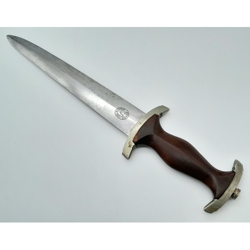 104 - An Early WWII Third Reich SA dagger by Maker Carl Wusthof. Cherry red mahogany grip. Marks on blade ... 