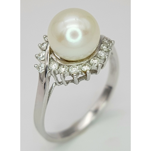 117 - AN 18K WHITE GOLD DIAMOND & PEARL SET RING. 3.8G. SIZE P. A/S1210.