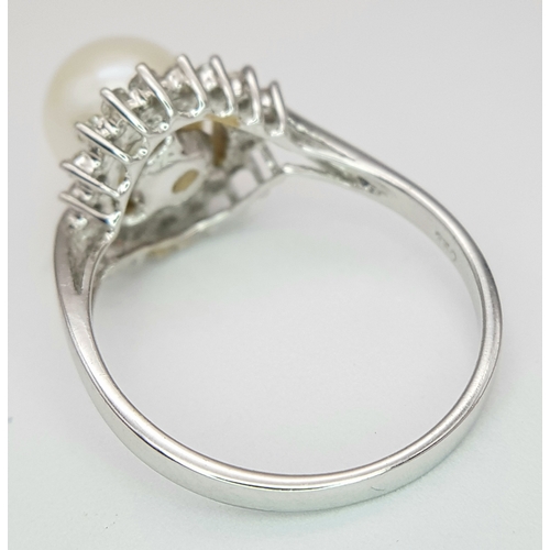 117 - AN 18K WHITE GOLD DIAMOND & PEARL SET RING. 3.8G. SIZE P. A/S1210.