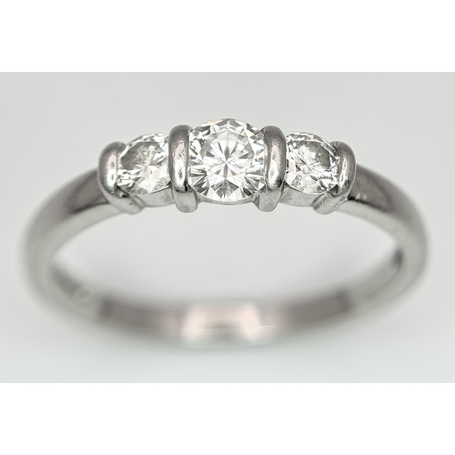 165 - A PLATINUM DIAMOND 3 STONE RING - 0.56CT CENTRE DIAMOND IS GIA CERTIFIED -0.26CT. H - COLOUR. VS1 CL... 