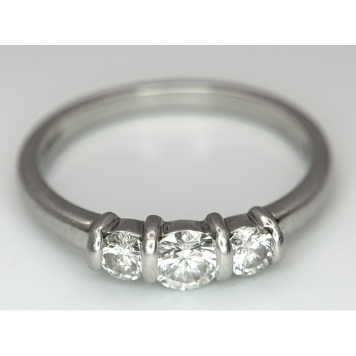 165 - A PLATINUM DIAMOND 3 STONE RING - 0.56CT CENTRE DIAMOND IS GIA CERTIFIED -0.26CT. H - COLOUR. VS1 CL... 