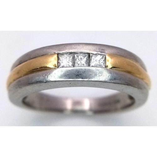 185 - A Stylish 18K Gold, 950 Platinum and Diamond Gents Dress Ring. Three princess cut diamonds amongst g... 