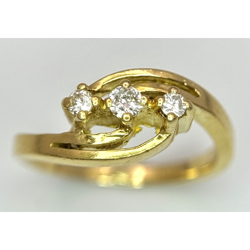 193 - AN 18K YELLOW GOLD THREE STONE DIAMOND CROSSOVER RING - 2.8G. SIZE G. A/S 1219.