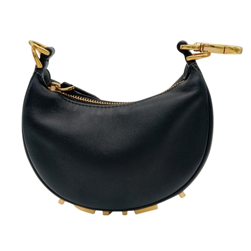 249 - A Fendi Black Leather Moon Micro Bag. Black leather exterior with gold-toned hardware and large FEND... 