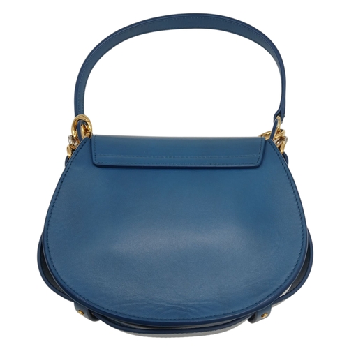 263 - A Chloé Blue Leather Tess Bag. Blue leather exterior with gold-toned hardware, top handle, detachabl... 