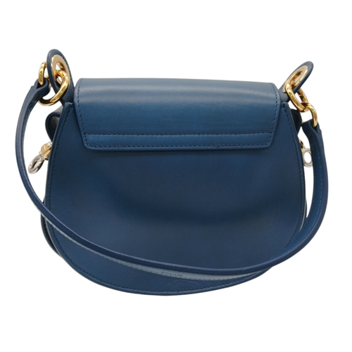 263 - A Chloé Blue Leather Tess Bag. Blue leather exterior with gold-toned hardware, top handle, detachabl... 