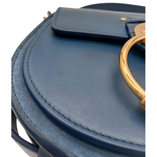 263 - A Chloé Blue Leather Tess Bag. Blue leather exterior with gold-toned hardware, top handle, detachabl... 