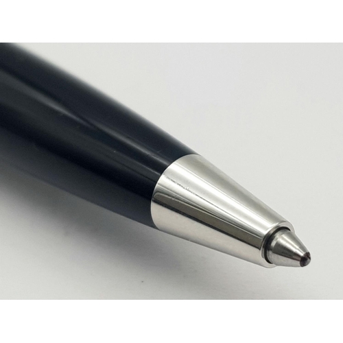 321 - A Montblanc Ball Point Pen. Black lacquered finish. 13.5cm. Good condition.