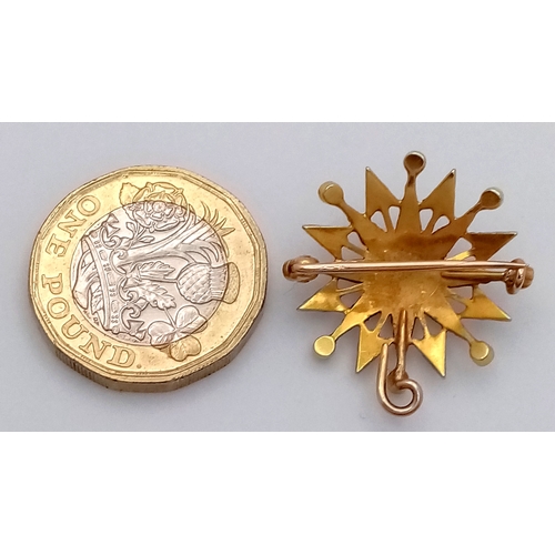 323 - An Antique Mid Karat (14/15K) Gold  Seed Pearl Star Burst Brooch/Pendant. 2.5cm. 3.18g