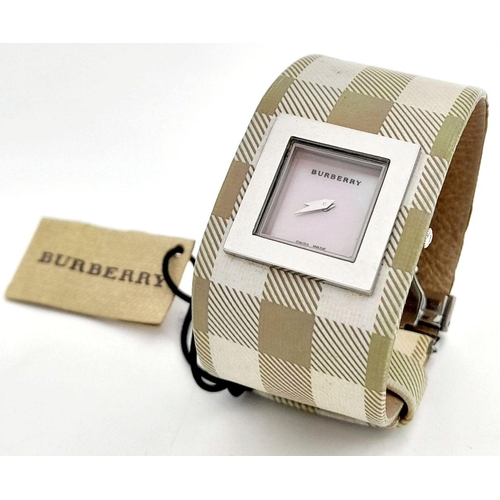 335 - A Burberry Quartz Ladies Watch. Textile strap. Stainless steel border case. Mother of pearl dial. In... 