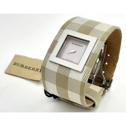 335 - A Burberry Quartz Ladies Watch. Textile strap. Stainless steel border case. Mother of pearl dial. In... 