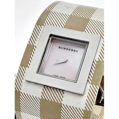 335 - A Burberry Quartz Ladies Watch. Textile strap. Stainless steel border case. Mother of pearl dial. In... 