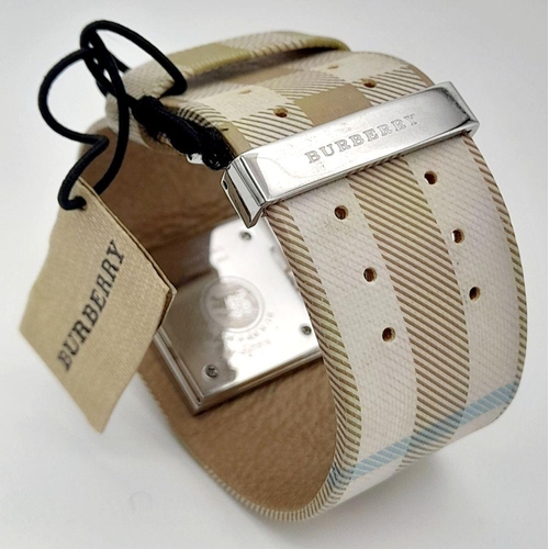 335 - A Burberry Quartz Ladies Watch. Textile strap. Stainless steel border case. Mother of pearl dial. In... 