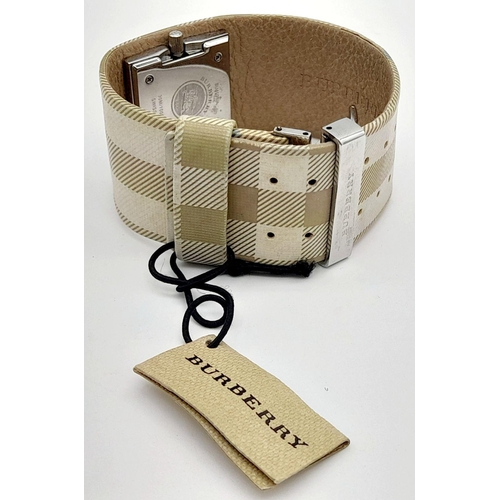 335 - A Burberry Quartz Ladies Watch. Textile strap. Stainless steel border case. Mother of pearl dial. In... 