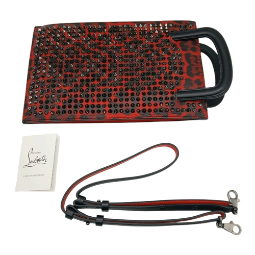 340 - A Christian Louboutin Red Leather Studded Clutch Shoulder Bag. Gunmetal coloured studs. Exterior poc... 