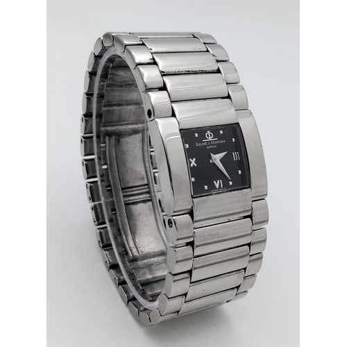 343 - A BAUME AND MERCIER LADIES WATCH IN STAINLESS STEEL WITH STUNNING BLACK DIAL AND QUARTZ MOVEMENT .