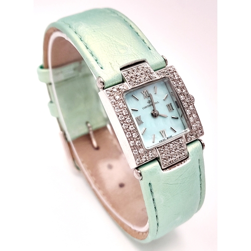 534 - A Ladies Continental Quartz Watch. Green leather strap. Stainless steel and white stone case - 22mm.... 