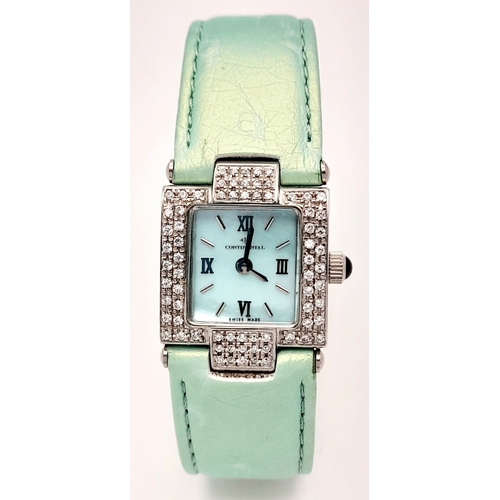 534 - A Ladies Continental Quartz Watch. Green leather strap. Stainless steel and white stone case - 22mm.... 