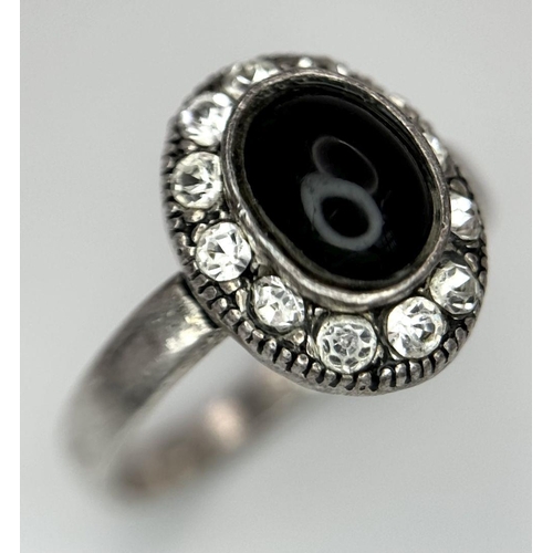 553 - A fancy 925 silver Onyx and Zirconia cluster ring. Total weight 3G. Size N/O.