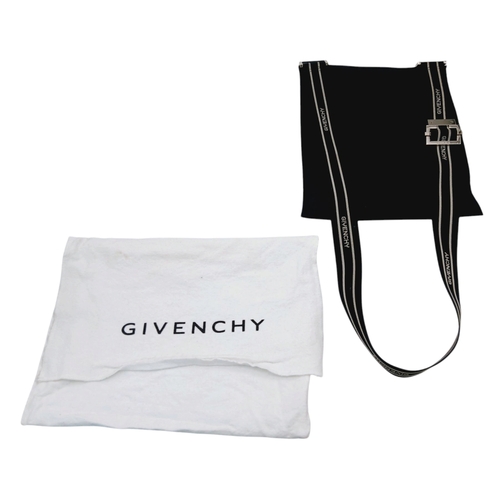 611 - A Givenchy Black Canvas Crossbody Bag. Black canvas exterior with silver-toned hardware, featuring a... 