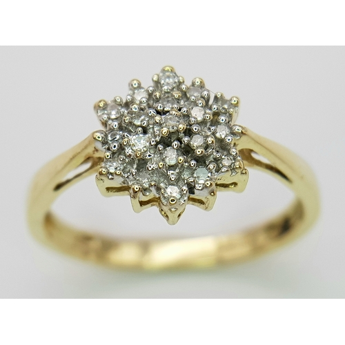 635 - A 9K YELLOW GOLD DIAMOND SET CLUSTER RING 2.2G TOTAL WEIGHT, SIZE N. Ref: 9303