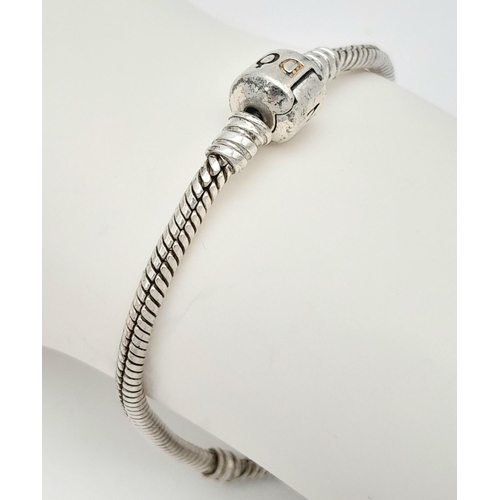 669 - A PANDORA SILVER BRACELET .   14.5gms