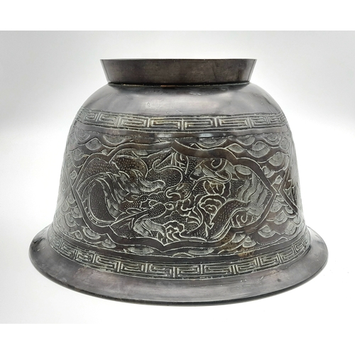 115 - An Antique Bronze Chinese Pedestal Bowl. Decorative dragon engravings. Interesting mark on base. 26c... 