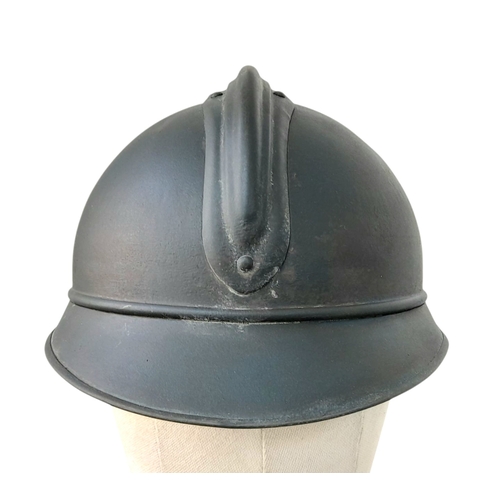 173 - A WW1 French Mle 15 Adriane Infantry Helmet with original liner and cap badge.