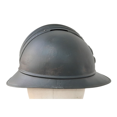 173 - A WW1 French Mle 15 Adriane Infantry Helmet with original liner and cap badge.