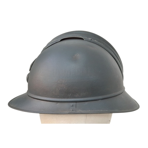 173 - A WW1 French Mle 15 Adriane Infantry Helmet with original liner and cap badge.